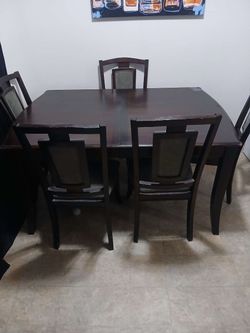Dark wood dining table set