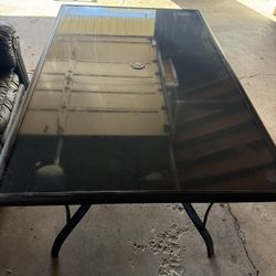 Outdoor glass patio table with umbrella hole 