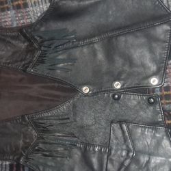 Black Vest With Hardley Davison Painting On It 