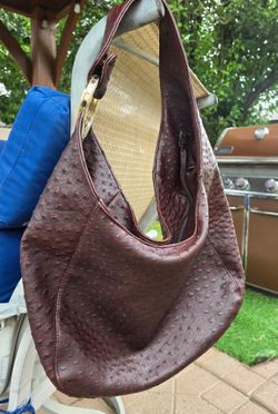 Brown redish Ostrich-embossed FAUX leather hobo bag featuring a curved silhouette, distinct quill patterns, and a thick single shoulder strap accented