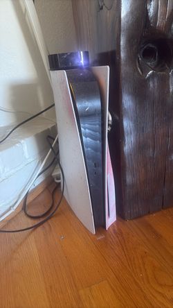PS5 with disc and controller