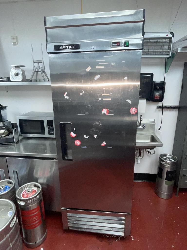 ARGUS single door reach-in refrigerator in good working condition.