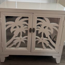 Coast to Coast 2 Door Cabinet With Palm Tree Cutout