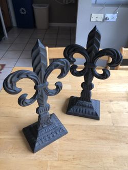 Two black cast iron statues