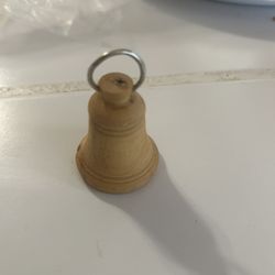 small, hand-carved olive wood bell ornament, from Bethlehem