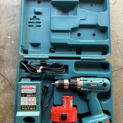 Makita electric with two batteries and charger and case as shown in picture 