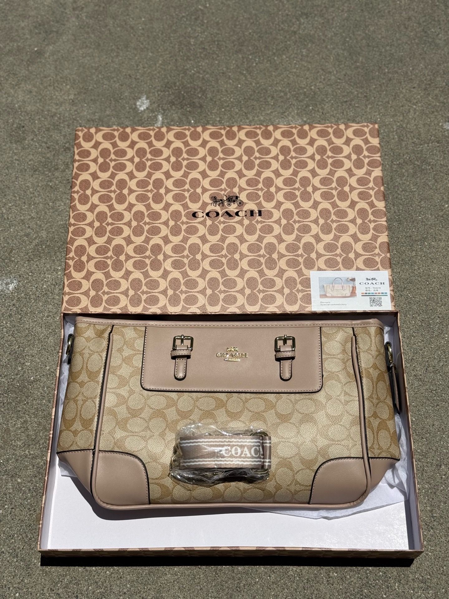Coach Station Tote Bag features the brand's signature monogram canvas