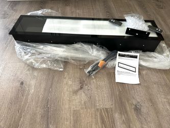 40 inch Black Electric Fireplace Insert( Brand New), which often includes remote control capabilities for adjusting flame effects and heat $150
