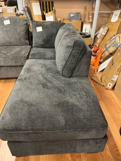 Dark gray upholstered corner sofa