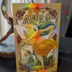 Shimmering Aura Tarot Cards with book and magnetic closure box.
This set is seriously stunning. 
This set was never used, And I am thinning out my t