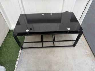 Glass TV stand with 2 lower shelves