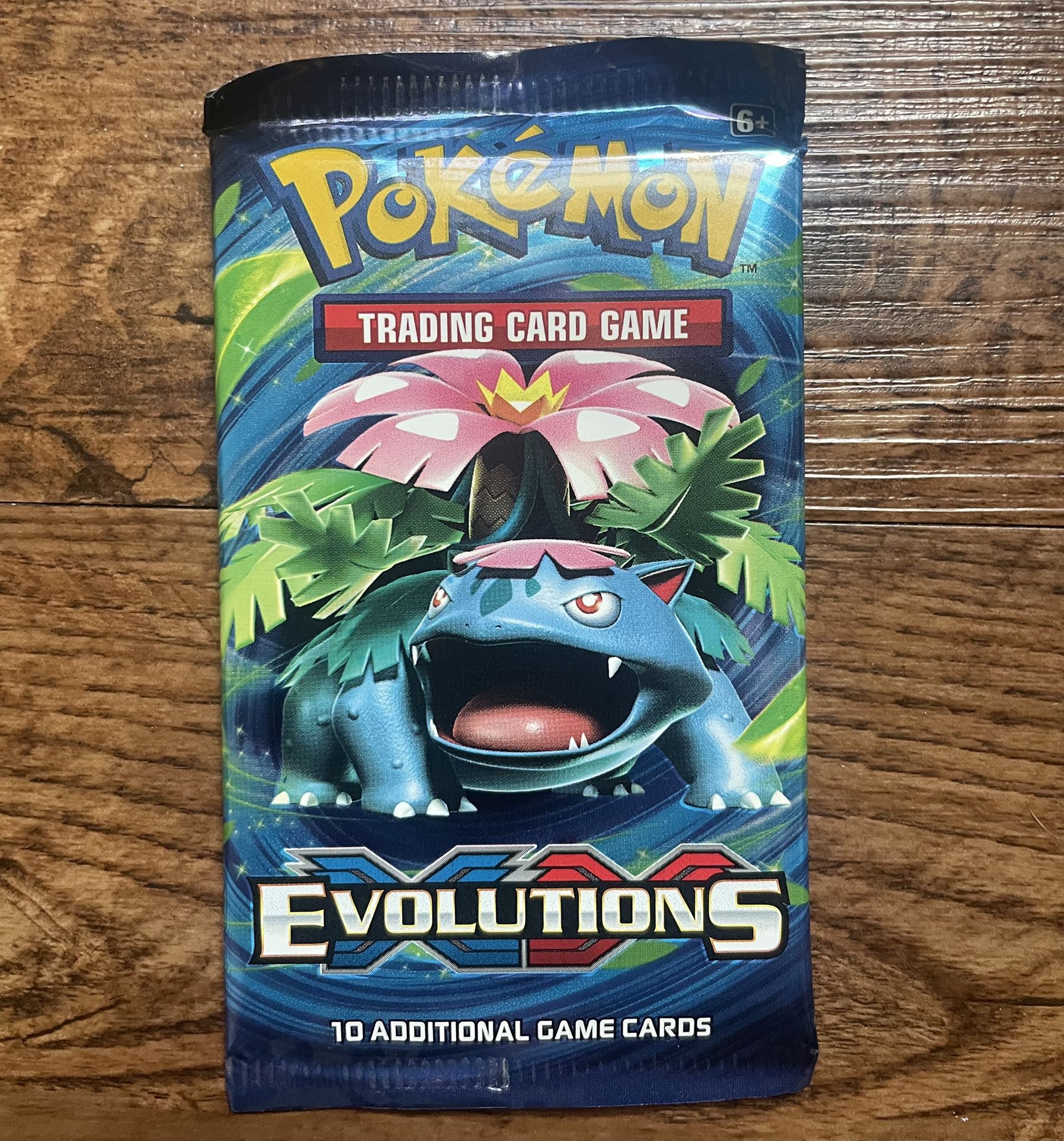 Sealed 2016 Pokemon TCG XY Evolutions 10 card Booster Pack.  I took this out of a collection box.  Rare XY Evolutions Charizard reverse Holo card?!