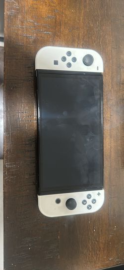 Nintendo Switch OLED console with dock and charger