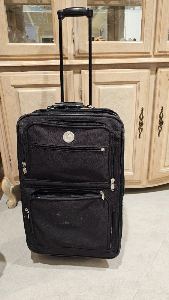 Carry On Bag On Wheels. 4 Zipper Compartments. Great Buy