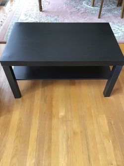 Black coffee table with shelf