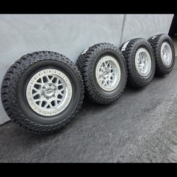 17" KMC rims w- 32" Cooper STT tires