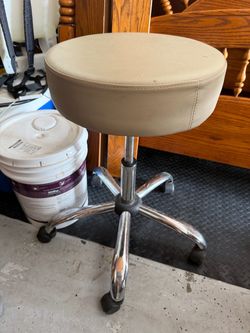 Height adjustable, rolling stool