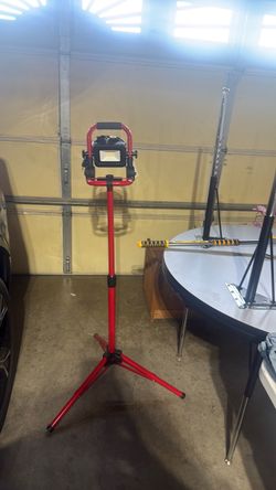 It’s a portable LED work light with an adjustable tripod stand.