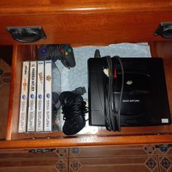 Sega Saturn with games