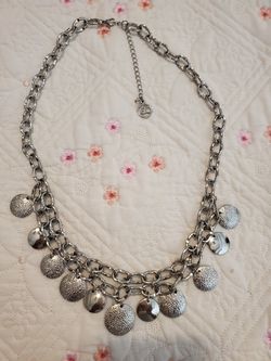 Erika Lyons disc charms silver tone necklace.
