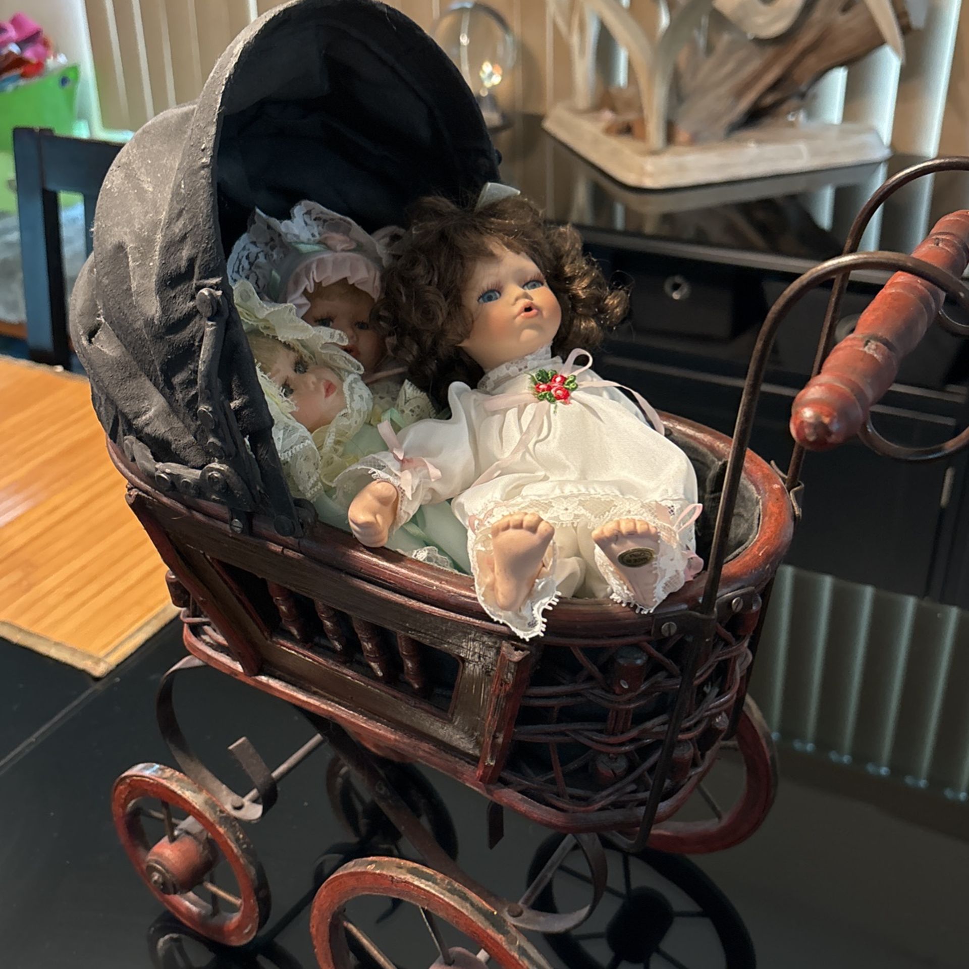 Antique Baby Carriage With Three Dolls