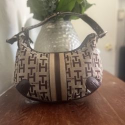 This is a vintage Tommy Hilfiger monogram shoulder bag in beige and brown