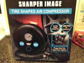 Brand new tire compressor plugs in cigarette lighter