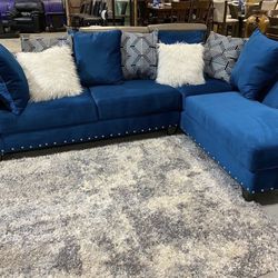 New Blue Sectional Sofa With White And Blue Pillows