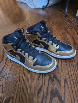 Air Jordan 1 Mid Black and Gold Sneakers