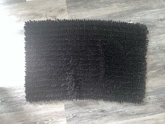 Two small black mats