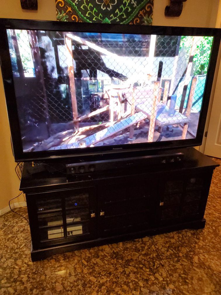 65" HD TV with Entertainment Center and Sound Bar