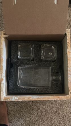 Whiskey container and two glasses