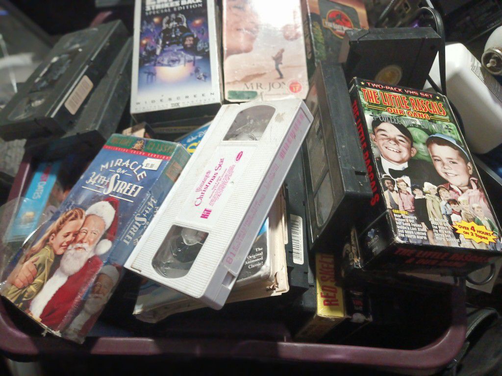 VHS Movies And Other Items Look Through The Pictures
