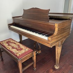 Antique baby grand piano