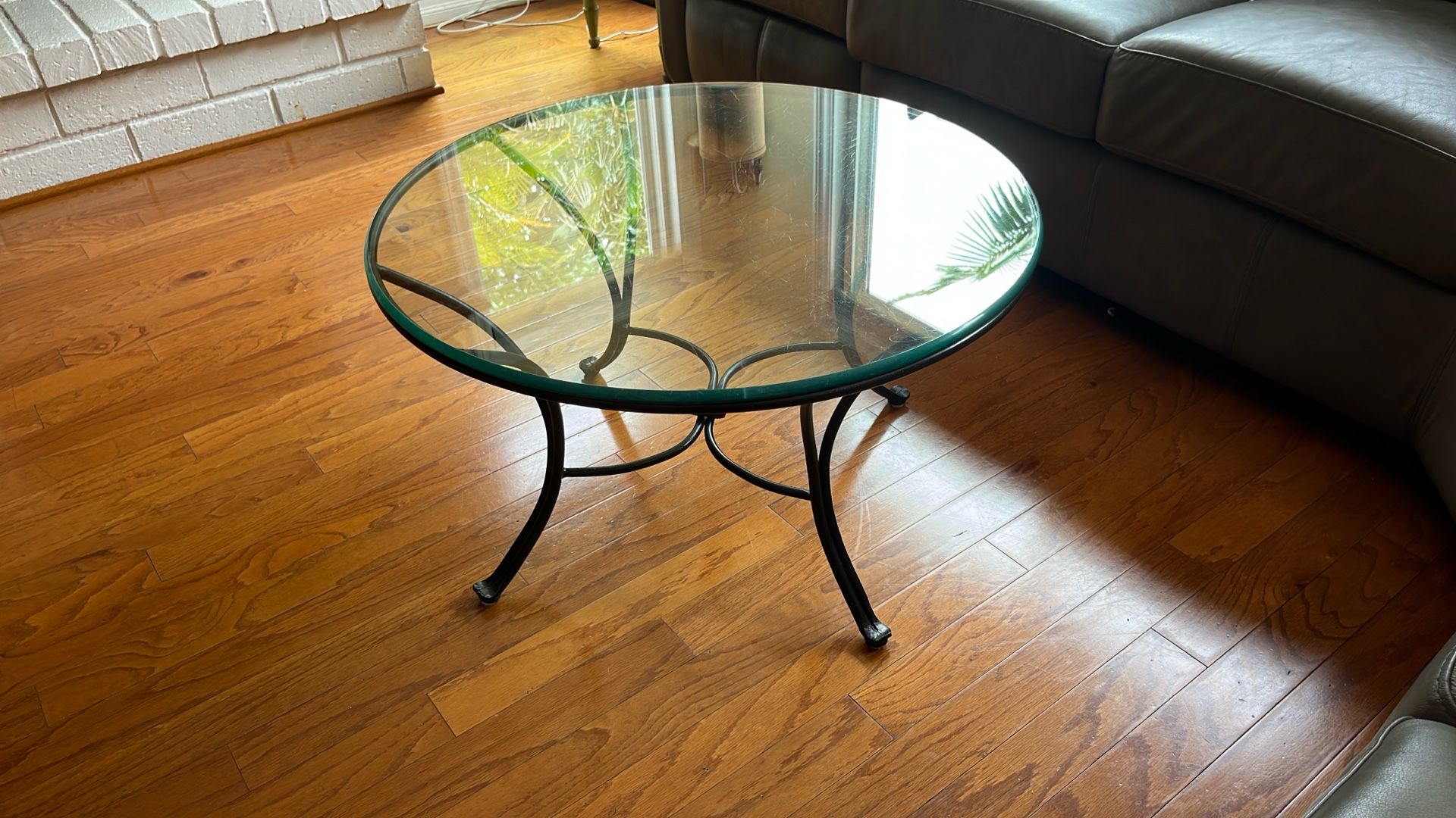 Round glass coffee table.