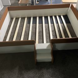 Full size b ed. Leather headboard and rails.