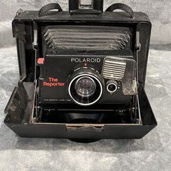 Vintage black Polaroid "The Reporter" instant film land camera