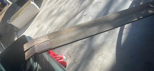 Wood planks to load lawn equipment on truck