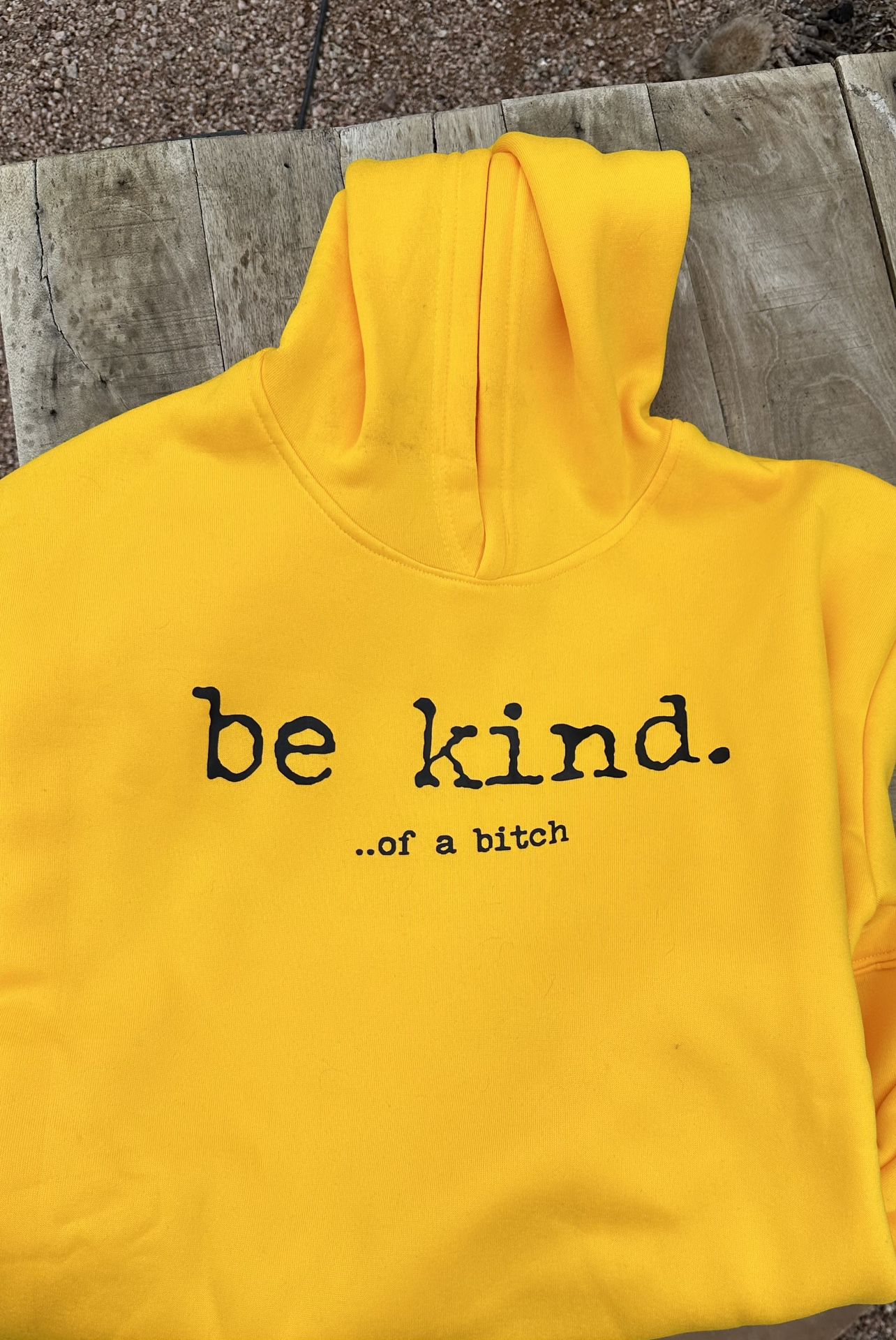“be kind. …of a b—h” on chest of hoodie
