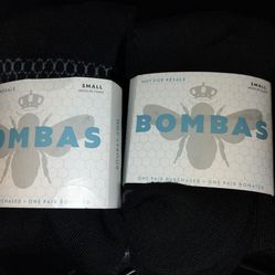 Small picture frame & 2 pairs of socks, size small.