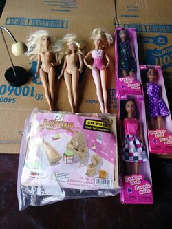 Lot of 6 Barbie dolls and furniture