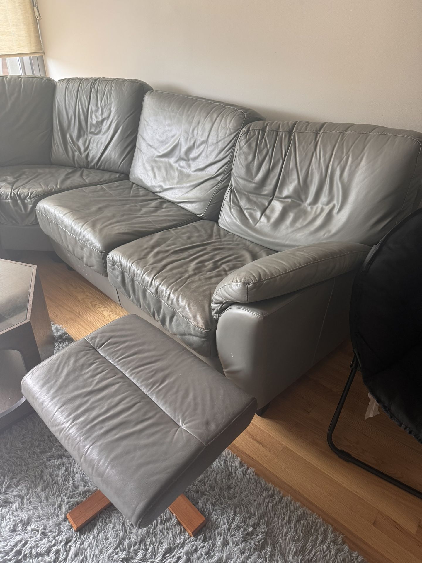 L shaped leather couch & footrest