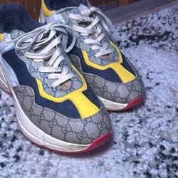 Gucci Rhyton sneakers with the GG monogram and multicolor paneling (yellow/navy/red).
