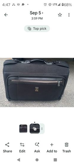 Travelpro... black (mid size) suitcase