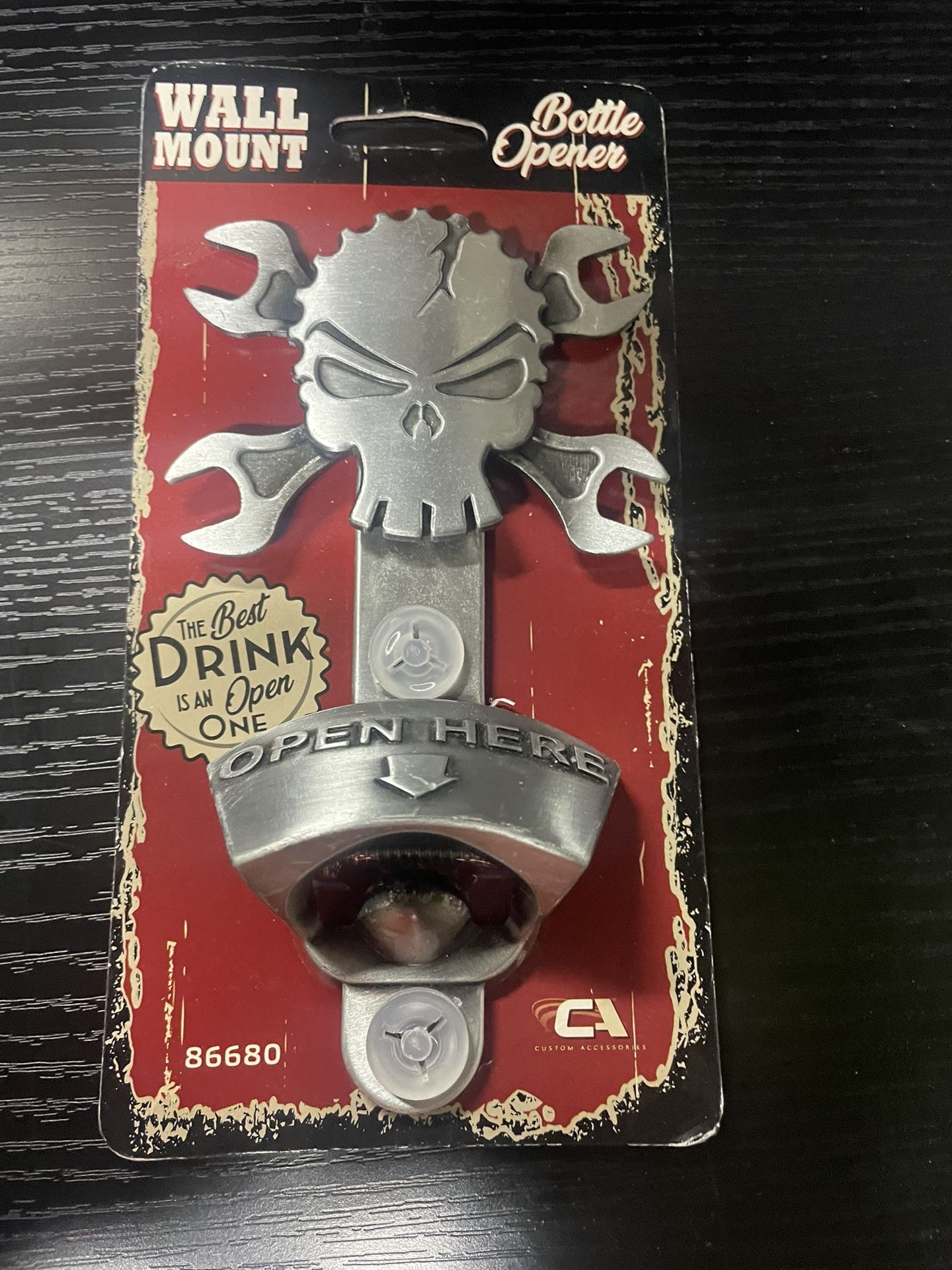 Silver metal skull bottle opener with wrench design