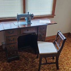 1928 Antique Sewing Machine And Chair