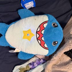This item is a Star Belly Dream Lites Snuggly Shark night light. 