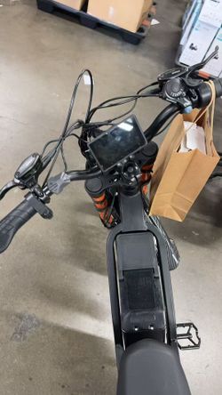 GT16 electric bike with 16-inch tires, peak power 749W, comes with a 48V 25AH battery, range of 65 miles, and hydraulic brakes.