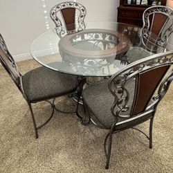 Ashley Furniture 5-Piece Glass & Iron Dining Set - 48" Round