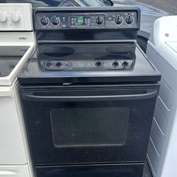 Black GE glass top stove